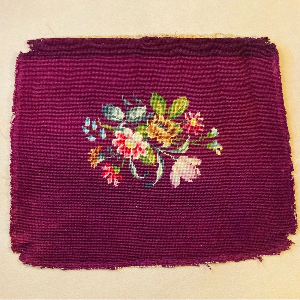 Beautiful vintage finished embroidery on burgundy wool, in fanciful floral’s